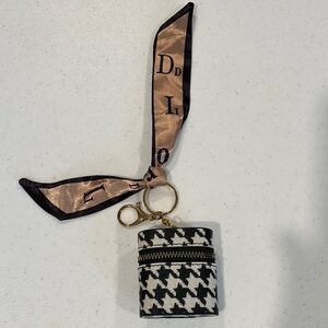Earbud Case Keychain NWOT
black & white with ribbon